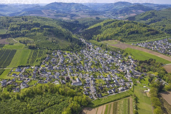 Aerial view, wooded hilly landscape, mountains and valleys, residential area local view district Ostwig, Bestwig, Sauerland, North Rhine-Westphalia, Germany, wooded, hilly landscape, mountains, valleys, residential area, local view, district, Ostwig, landscape, nature, vegetation, trees, houses, settlement, village, rural, hill, view, panorama, region, geography, Europe, green, summer, day, clear, peaceful, elevation, enclosure, field, topographical