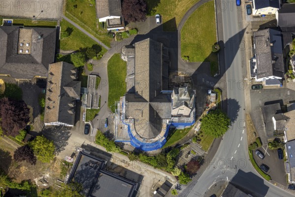 Aerial view, cat. Church of St. Anna, partial covering and scaffolding due to renovation work, Nuttlar, Bestwig, Sauerland, North Rhine-Westphalia, Germany, catholic church, Church of St. Anna, partial covering, scaffolding, renovation work, renovation, restoration, architecture, religious building, building, village, infrastructure, preservation, construction site, religion, church, exterior view, rural, aerial view, renewal, development, roof, towers, windows, brick, community, culture, ecclesiastical