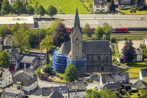 Aerial view, cat. Church of St. Anna, partial covering and scaffolding due to renovation work, Nuttlar, Bestwig, Sauerland, North Rhine-Westphalia, Germany, catholic church, St. Anna, partial covering, scaffolding, renovation work, church, architecture, renovation, restoration, building, religion, Christian, village, community, rural, aerial view, structure, tower, roofs, local view, monument, historical, construction project, church tower, summer, daylight, clear sky, Christian symbolism
