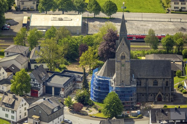 Aerial view, cat. Church of St. Anna, partial covering and scaffolding due to renovation work, Nuttlar, Bestwig, Sauerland, North Rhine-Westphalia, Germany, church, St. Anna, partial covering, scaffolding, renovation work, architecture, religious, historical, construction site, restoration, renovation, building, church tower, winter, afternoon, sunshine, village, surroundings, aerial view, perspective, religion, cultural heritage, rural, landscape