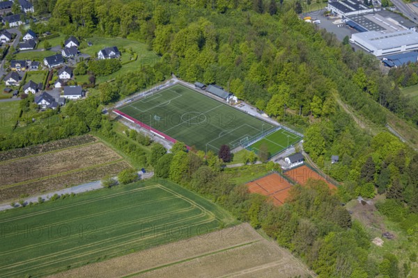 Aerial view, football stadium Ostwig sports ground, tennis courts, Ostwig, Bestwig, Sauerland, North Rhine-Westphalia, Germany, football stadium, sports ground, sports facilities, tennis, football, landscape, village, buildings, trees, green spaces, leisure, sport, athletics, infrastructure, recreation, open air, community, nature, architecture, city map, Europe, summer, daylight, playgrounds, competition, training, equipment