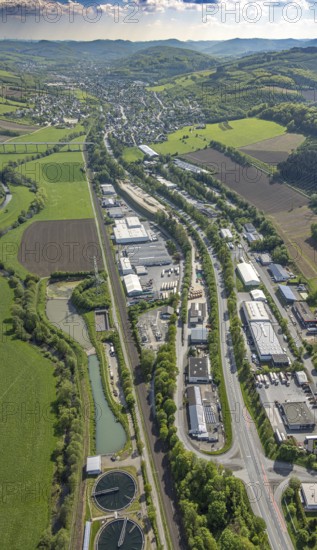 Aerial view, industrial area Im Öhler, distant view with view to Velmede and Ruhr valley bridge Velmede, logistics centre Spediiton Häger, hilly landscape, meadows and fields, Velmede, Bestwig, Sauerland, North Rhine-Westphalia, Germany, industrial area, distant view, Ruhr valley bridge, logistics centre, Spedition Häger, meadows, fields, infrastructure, transport, industrial area, landscape, rural, nature, hill, agriculture, building, motorway, traffic connection, commercial centres, aerial view, panorama, European, business, environment, logistics, topography, development, view, region