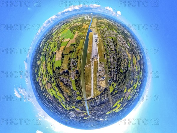 Aerial view, Water City Aden on the Datteln-Hamm Canal, construction area for planned urban quarter on the site of the former Haus Aden colliery, earth globe, fisheye image, fisheye image, 360 degree image, tiny world, little planet, fisheye image, Oberaden, Bergkamen, Ruhr area, North Rhine-Westphalia, Germany, Aden, architecture, construction area, construction site, Datteln-Hamm Canal, geography, Haus Aden, sky, industrial area, infrastructure, canal, landscape, landscape shot, panorama, perspective, planning, urban development, Tiny World, transformation, water town, former colliery, planned urban quarter, innovative planning, modern city, urban