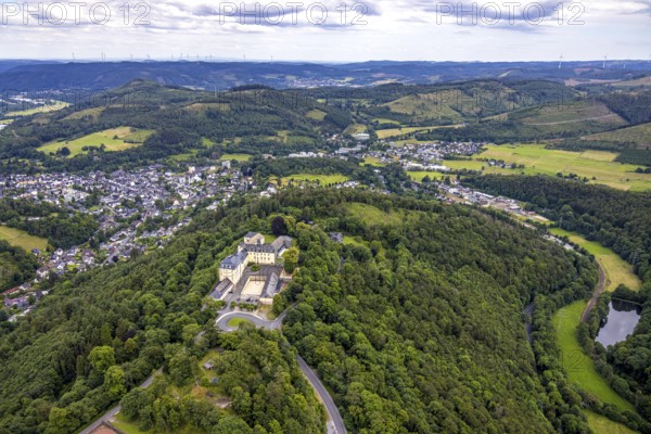 Aerial view, Wittgenstein Castle, view over Bad Laasphe with hilly landscape and distant view, Wittgenstein art, Bad Laasphe, Wittgensteiner Land, North Rhine-Westphalia, Germany, architecture, mountains, Europe, distant view, green areas, sky, hill, hilly landscape, culture, landscape, nature, panorama, sight, summer, city view, daylight, tourism, environment, urban, landmark, clouds, historical buildings, medieval