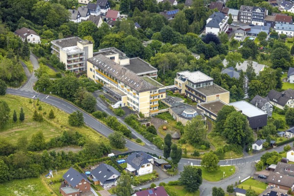 Aerial view, Schlossbergklinik HGC Kliniken GmbH, Schlossstraße, Bad Laasphe, Wittgensteiner Land, North Rhine-Westphalia, Germany, architecture, exterior view, trees, European Union, building, health, healthcare, HGC Kliniken GmbH, hill, infrastructure, clear sky, clinic, hospital, landscape, aerial view, medical facility, nature, village, care, region, Schlossbergklinik, summer, street, urban, day, environment, medical care
