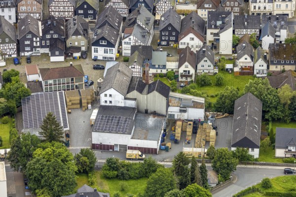 Aerial view, Bosch brewery on the river Laasphe in a residential area, Bad Laasphe, Wittgensteiner Land, North Rhine-Westphalia, Germany, architecture, architectural landscape, beer production, Bosch brewery, brewery, trees, German, company location, river Laasphe, river bank, building, industry, infrastructure, cultural landscape, nature, panorama, perspective, production, city, cityscape, transport, environment, urban, water, plant, economy, residential area, village, European, rural