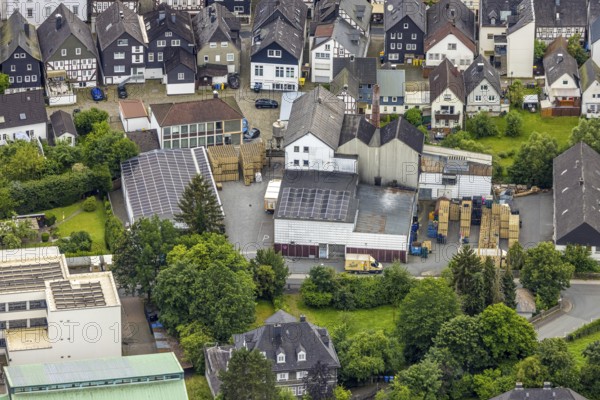 Aerial view, Bosch Brewery on the river Laasphe in a residential area, Bad Laasphe, Wittgensteiner Land, North Rhine-Westphalia, Germany, architecture, Bosch Brewery, roof, village, river, river Laasphe, building, industry, industrial area, infrastructure, landscape, aerial view, nature, perspective, summer, city, daytime, surroundings, company location, urban, forest, meadow, economy, residential area, rural, European, rural, medium-sized, regional
