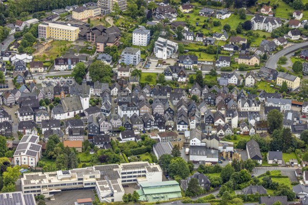 Aerial view, municipal grammar school, old town with historic houses and protestant town church, residential area between Gartenstraße and Steinackerstraße, catholic church St. Peter and Anna, above area of the former Emmaburg clinic, Bad Laasphe, Wittgensteiner Land, North Rhine-Westphalia, Germany, old town, architecture, buildings, education, village view, conservation, Gartenstraße, buildings, green areas, church tower, cultural heritage, landscape, aerial view, region, religion, St. Peter and Anna, town, cityscape, Steinackerstraße, street network, urban, bird's eye view, former Emmaburg clinic, historic houses, protestant town church, former Emmaburg clinic, catholic church St. Peter and Anna, Bad Laasphe, Wittgensteiner Land, North Rhine-Westphalia, Germany St Peter and St Anne, town, townscape, Steinackerstrasse, street network, urban, bird's eye view, residential area, residential buildings, former Emmaburg Clinic, Protestant town church, historic houses, Catholic church, urba...