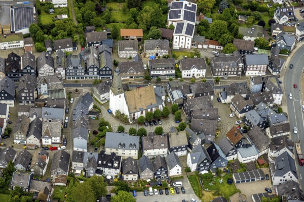 Aerial view, protestant town church and church square in the town centre with historic half-timbered houses, Bad Laasphe, Wittgensteiner Land, North Rhine-Westphalia, Germany, old town, architecture, treetops, village, roofs, buildings, history, green trees, sky, idyll, church square, church tower, culture, landscape, town centre, panorama, religion, sight, summer, city view, tourism, protestant town church, historic half-timbered houses, rural, traditional
