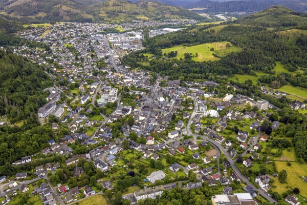 Aerial view, residential area local view, surrounded by hilly forest landscape with forest damage, Bad Laasphe, Wittgensteiner Land, North Rhine-Westphalia, Germany, trees, village, roofs, recreation, forest, community, green, timber industry, houses, hill, contrast, landscape, nature, local view, perspective, region, damage, settlement, summer, urban planning, streets, daylight, topography, environment, environmental, environmental problems, urban, forest, forest landscape, forest damage, residential area, hilly, rural, vegetation