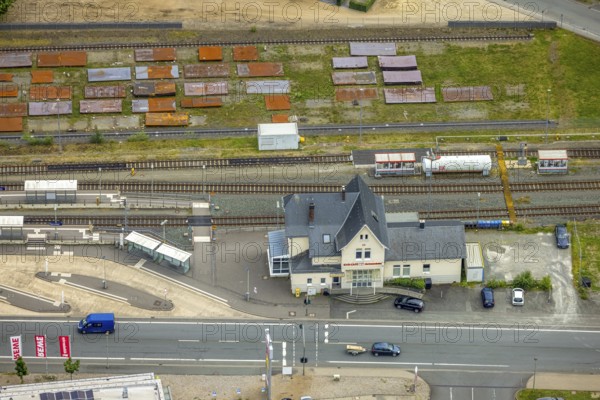 Aerial view, Bad Laasphe railway station and station building, Bad Laasphe, Wittgensteiner Land, North Rhine-Westphalia, Germany, architecture, railway station, station building, roofs, railway, building, tracks, green areas, infrastructure, small town, landscape, logistics, aerial view, central Germany, location, commuter, region, travel, view, summer, city, station, roads, structure, day, transport, environment, urban, traffic, trains, rural, overview