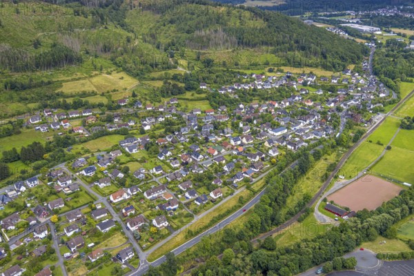 Aerial view, sports field Niederlaasphe, Niederlaasphe SG, residential area local view at the forest Niederlaasphe, Bad Laasphe, Wittgensteiner Land, North Rhine-Westphalia, Germany, architecture, trees, recreation, open air, leisure, building, community, green, houses, small town, landscape, landscape view, aerial view, nature, Niederlaasphe, local view, region, sector, settlement, playing field, sports field, townscape, structure, daylight, environment, forest, residential area, village, rural, review