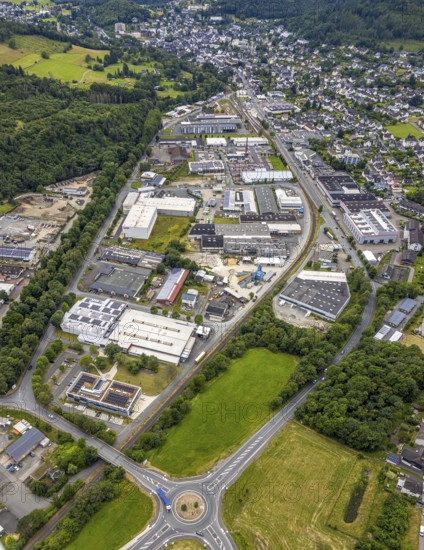 Aerial view, commercial area in the Aue, roundabout Bahnhofstraße federal road, B62, residential area around Thüringer Weg and Hirtsgrunder Weg, Bad Laasphe, Wittgensteiner Land, North Rhine-Westphalia, Germany, architecture, Aue, Bahnhofstraße, federal road, European Union, building, commercial area, Hirtsgrunder Weg, industry, infrastructure, roundabout, landscape, region, settlement, town, town planning, roads, Thüringer Weg, top-down, transport, urban, traffic, residential area, residential buildings, geographical, rural, above, flyover