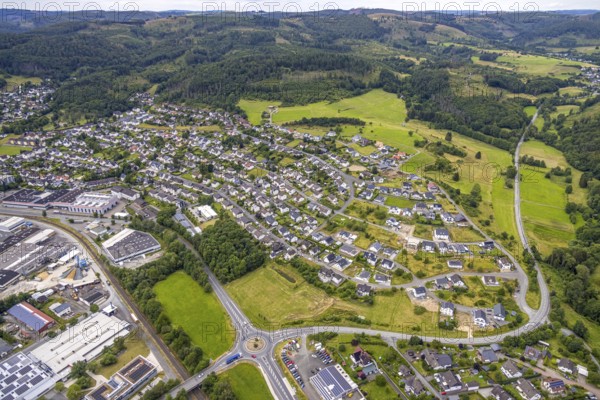 Aerial view, new residential area Am Galgenberg, roundabout federal road B62, forest area, Bad Laasphe, Wittgensteiner Land, North Rhine-Westphalia, Germany, Am Galgenberg, architecture, exterior view, construction project, federal road B62, trees, village, development, new construction, green, infrastructure, roundabout, landscape, nature, new construction, planning, region, settlement, roads, road junction, urban, environment, traffic, forest, residential area, residential houses, rural