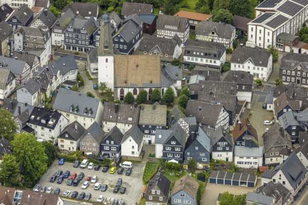 Aerial view, protestant town church and church square in the town centre with historic half-timbered houses, Bad Laasphe, Wittgensteiner Land, North Rhine-Westphalia, Germany, old town, architecture, tree, monument, village, village centre, drone shot, half-timbered, building, green trees, home, autumn, church, church square, church tower, culture, landscape, town centre, perspective, religion, sight, settlement, townscape, town centre, tradition, protestant town church, historic architecture, historic half-timbered houses, rural