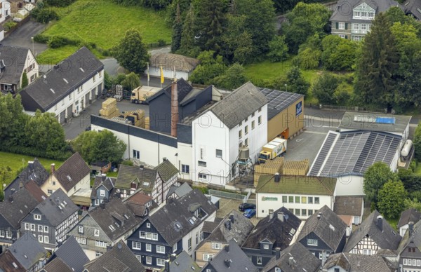 Aerial view, Bosch Brewery on the River Laasphe, Bad Laasphe, Wittgensteiner Land, North Rhine-Westphalia, Germany, architecture, Bosch Brewery, brewery, brewing art, bridge, Europe, factory, river, river Laasphe, building, trade, hill, industry, infrastructure, culture, landscape, nature, panorama, production, region, city, city view, road, tradition, transport, environment, bird's eye view, forest, water, wooded, rural, economic