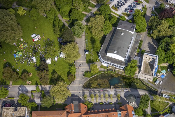 Aerial view, Bad Lippspringe Congress Centre, Arminius Park with castle ruins and river Lippequelle and Arminius Quelle Pavilion, Father's Day celebration in Arminius Park at the Congress Centre, visitors on the meadow, bouncy castle and drinks stands, Bad Lippspringe, East Westphalia, North Rhine-Westphalia, Germany, Congress Centre, Arminius Park, castle ruins, river, Lippequelle, Arminius spring pavilion, Father's Day festival, visitors, meadow, bouncy castle, drinks stands, celebration, leisure, event, family, children, adults, outdoor, town, park, culture, tradition, German, entertainment, green space, architecture, nature, water, building, landscape, day, summer, society, get-together, fun, pleasure