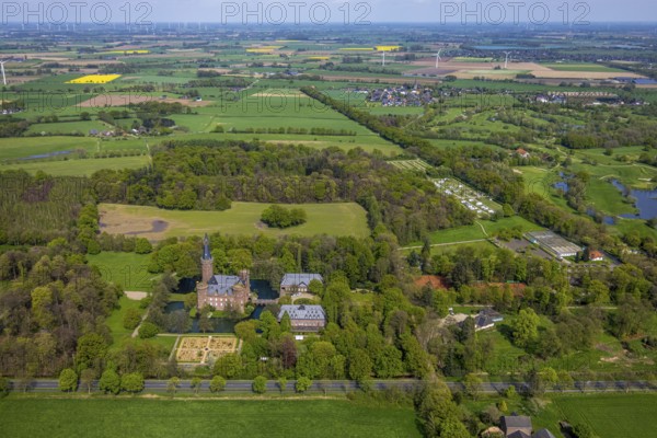Aerial view, Museum Schloss Moyland, neo-Gothic moated castle and castle park surrounded by meadows and fields and forest, excursion destination on the Lower Rhine, Moyland, Bedburg-Hau, Lower Rhine, North Rhine-Westphalia, Germany, architecture, excursion destination, exterior view, building, castle, trees, top view, recreation, fields, leisure, garden, history, green, sky, culture, cultural heritage, landscape, nature, perspective, castle park, beauty, sight, daylight, pond, tourism, forest, water, meadows, historical, neo-gothic moated castle