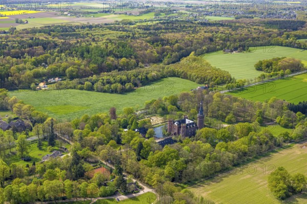 Aerial view, Museum Schloss Moyland, neo-Gothic moated castle and castle park surrounded by meadows and fields and forest, excursion destination on the Lower Rhine, Moyland, Bedburg-Hau, Lower Rhine, North Rhine-Westphalia, Germany, architecture, excursion destination, tree, building, visitor destination, DE, recreation, Europe, fields, leisure, garden, history, green spaces, sky, culture, cultural heritage, landscape, aerial view, aerial photography, aerial photography, museum, nature, park, Moyland Castle, castle park, sight, day, tourism, overview, bird's-eye view, forest, moated castle, meadows, birds-eyes view, outdoors, historical, neo-gothic, overview