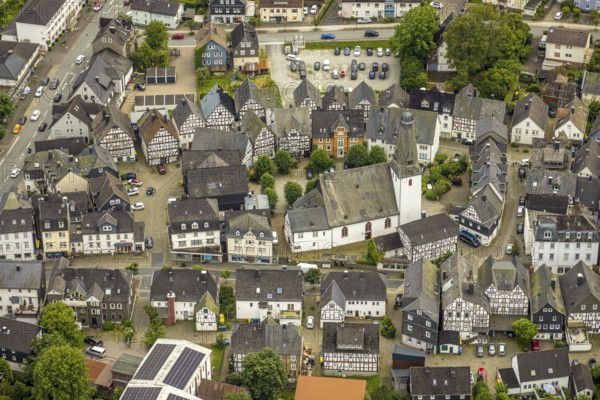Aerial view, protestant town church and church square in the town centre with historic half-timbered houses, Bad Laasphe, Wittgensteiner Land, North Rhine-Westphalia, Germany, old town, architecture, village, half-timbered, building, history, green trees, home, church, church square, culture, landscape, aerial view, nature, town centre, religion, sight, summer, town, cityscape, tourism, tradition, wooded, protestant town church, peaceful, historic half-timbered houses, rural, picturesque