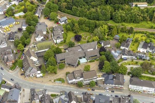 Aerial view, Mushroom Museum at Wilhelmsplatz, gardens and railway line, Bad Laasphe, Wittgensteiner Land, North Rhine-Westphalia, Germany, architecture, outdoor shot, railway line, trees, railway, Europe, gardens, building, tracks, green area, infrastructure, municipal, culture, landscape, museum, nature, park, mushroom museum, travel photography, sight, summer, city, tourism, environment, urban, traffic, bird's eye view, meadows, Wilhelmsplatz, cloudy, German city