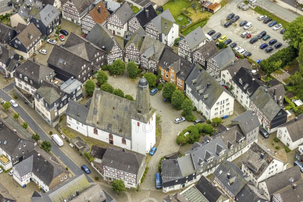 Aerial view, protestant town church and church square in the town centre with historic half-timbered houses, Bad Laasphe, Wittgensteiner Land, North Rhine-Westphalia, Germany, old town, architecture, tree, village, building, community, history, green trees, sky, idyllic, church, church square, culture, landscape, nature, town centre, panorama, region, religion, sight, structure, tourism, tradition, urban, European, protestant town church, historic half-timbered houses, rural, sacral