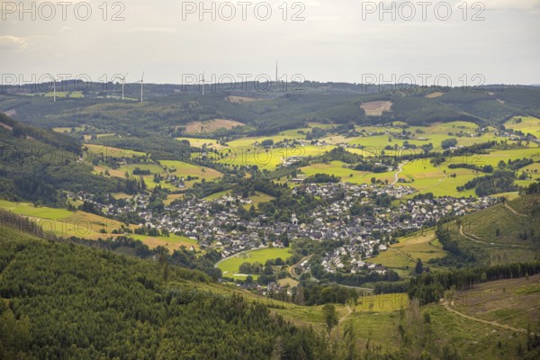 Aerial view, view of Feudingen in the valley, evang. Church and half-timbered houses, view of village and residential area, meadows and fields in hilly landscape, wooded area with forest damage, distant view, Feudingen, Bad Laasphe, Wittgensteiner Land, North Rhine-Westphalia, Germany, architecture, village, Europe, half-timbered houses, fields, buildings, hilly landscape, culture, landscape, agriculture, nature, natural disaster, local view, panorama, realism, religion, settlement, valley, environmental problems, forest area, forest damage, meadows, residential area, evangelic church, historical, rural, traditional, vegetation