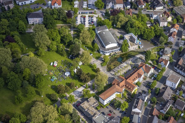 Aerial view, Congress Centre Bad Lippspringe, Arminius Park with castle ruins and river Lippequelle and Arminius Quelle Pavilion, Father's Day celebration in Arminius Park at the Congress Centre, visitors on the meadow, bouncy castle and drink stands, Bad Lippspringe, East Westphalia, North Rhine-Westphalia, Germany, Congress Centre, Arminius Park, castle ruins, river, Lippe Spring, Arminius Spring Pavilion, Father's Day festival, visitors, meadow, bouncy castle, drinks stands, celebration, leisure, family, recreation, people, children, adults, get-together, nature, park, history, architecture, daylight, landscape, culture, event, outdoors, summer, green, water, trees, fun, community