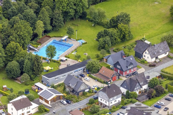Aerial view, outdoor swimming pool Feudingen, Bad Laasphe, Wittgensteiner Land, North Rhine-Westphalia, Germany, activity, architecture, outdoor shot, outdoor area, bathing season, pool, trees, village, relaxation, refreshment, recreation, Feudingen, outdoor pool, leisure, building, community, green areas, sky, landscape, nature, park, pavilion, swimming pool, swimmer, summer, sun, sport, tourism, water, rural, swimming