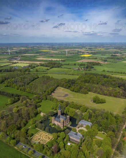 Aerial view, Museum Schloss Moyland, neo-Gothic moated castle and castle park surrounded by meadows and fields and forest, excursion destination on the Lower Rhine, Moyland, Bedburg-Hau, Lower Rhine, North Rhine-Westphalia, Germany, architecture, excursion destination, outdoor shot, building, visitor, trees, recreation, fields, leisure, history, green space, sky, culture, cultural heritage, landscape, museum, nature, panorama, park, tranquillity, Moyland Castle, castle park, sight, day, tourism, forest, water, meadows, historic, picturesque, neo-Gothic moated castle