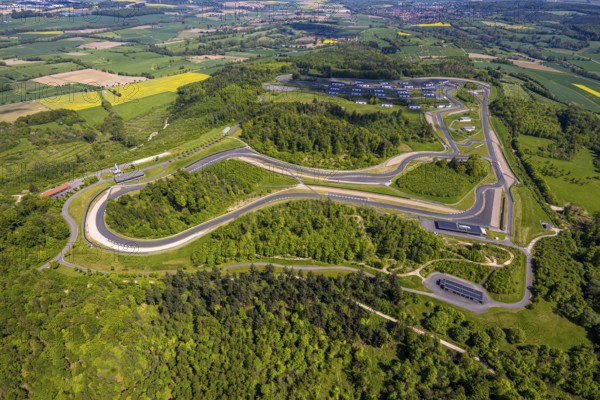 Aerial view, Bilster Berg race track, test track and presentation track, park-like terrain with paddock and off-road course, Pömbsen, Bad Driburg, East Westphalia, North Rhine-Westphalia, Germany, Bilster Berg, race track, test track, presentation track, park-like, paddock, off-road course, terrain, nature, trees, roads, curves, landscape, outdoor, sport, motorsport, vehicles, technology, recreation, green areas, leisure, facility, architecture, infrastructure, aerial view, perspective, day, tranquillity