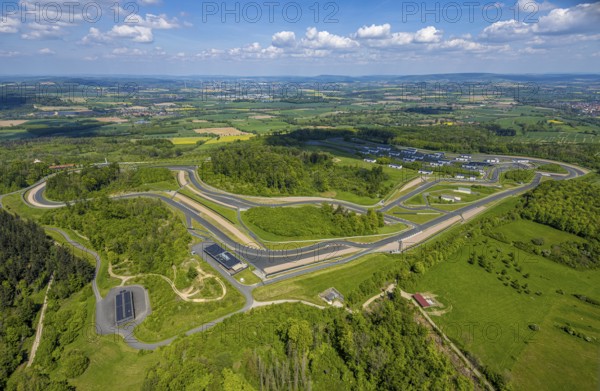Aerial view, Bilster Berg race track, test track and presentation track, park-like terrain with paddock and off-road course, Pömbsen, Bad Driburg, East Westphalia, North Rhine-Westphalia, Germany, Bilster Berg, race track, test track, presentation track, park-like, paddock, off-road course, terrain, autosport, motorsport, vehicles, nature, trees, green spaces, outdoor, landscape, facility, aerial view, technology, leisure, sport, recreation, innovation, design, architecture, infrastructure, traffic, tourism, leisure design, venue, complex, pilot project