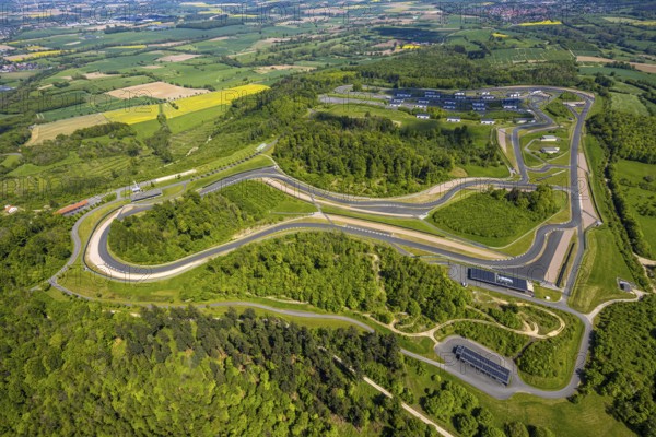 Aerial view, Bilster Berg race track, test track and presentation track, park-like terrain with paddock and off-road course, Pömbsen, Bad Driburg, East Westphalia, North Rhine-Westphalia, Germany, Bilster Berg, race track, test track, presentation track, park-like, paddock, off-road course, terrain, motorsport, facility, nature, green space, vehicles, routing, curves, asphalt, leisure, sport, landscape, hills, trees, outdoor, panorama, aerial view, technology, infrastructure, recreation, event location, tourism, sight, architecture, planning, building