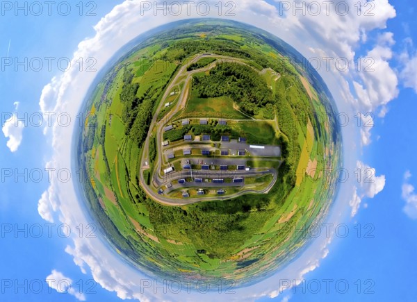 Aerial view, Bilster Berg race track, test track and presentation track, park-like terrain, paddock with solar roofs, globe, fisheye image, fisheye image, 360 degree image, tiny world, little planet, fisheye image, Pömbsen, Bad Driburg, East Westphalia, North Rhine-Westphalia, Germany, test track, presentation track, park-like, terrain, paddock, solar roofs, solar systems, fisheye, fisheye, 360 degree, race track, motorsport, landscape, nature, technology, energy efficiency, renewable energies, modern design, infrastructure, environment, sustainability, aerial view, drone image, topographical, car, vehicle