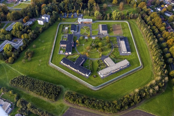 Aerial view, Forensic Psychiatry - LVR Clinic, Houses F1 to F7, Bedburg-Hau, Lower Rhine, North Rhine-Westphalia, Germany, arrangement, architecture, exterior view, buildings, trees, roofs, F1, F2, F3, F4, F5, F6, F7, Forensic Psychiatry, building, terrain, geometry, healthcare facility, green areas, infrastructure, clinic, complex, LVR Clinic, landscape, aerial view, medical facility, planning, region, sun, structure, day, environment, institutional, overview