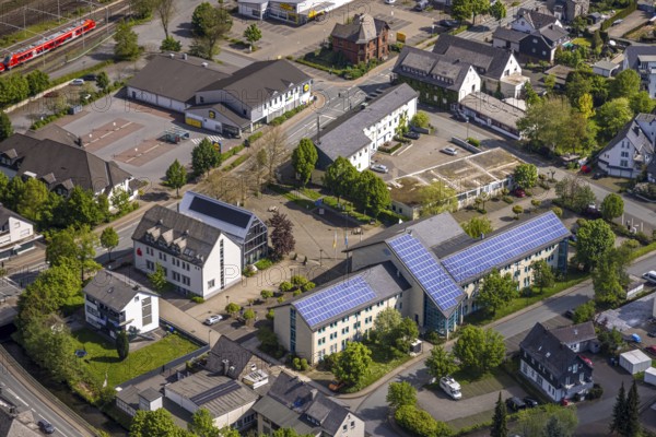 Aerial view, municipal administration town hall Bestwig with solar roof, town hall square, Lidl supermarket, Sparkasse Hochsauerland, Bestwig, Sauerland, North Rhine-Westphalia, Germany, municipal administration, town hall, solar roof, Lidl, supermarket, Sparkasse, Hochsauerland, building, town, infrastructure, photovoltaics, retail, banks, public building, architecture, town centre, energy efficiency, sustainability, technology, renewable energies, street, traffic, economy, village, surroundings, exterior view, modern, administration, business, shopping centre, solar energy