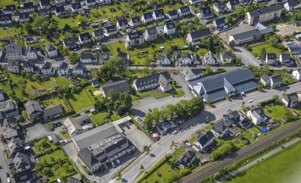 Aerial view, Schützenhalle Velmede festival hall, Hoffmann Forsttechnik und Gartentechnik Montessori day care centre Villa Kunterbunt, Andreas-Grundschule, residential area Kapellenstraße, Bestwig, Sauerland, North Rhine-Westphalia, Germany, Schützenhalle, Velmede festival hall, Hoffmann Forsttechnik, Gartentechnik, Montessori day care centre, Villa Kunterbunt, residential area, Kapellenstraße, town, building, infrastructure, architecture, rural, schools, day care centre, residential buildings, municipality, overview, perspective, top view, facilities, education, trade, daytime, Europe, location, development