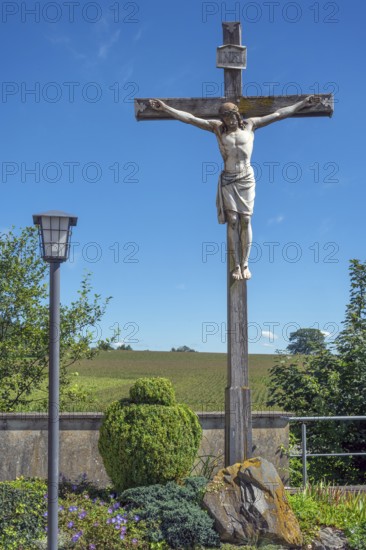 Crucifix and lantern at the Roman Catholic parish church of the Assumption of the Virgin Mary in Gebrazhofen, district of the large district town of Leutkirch im Allgäu, district of Ravensburg, Baden-Württemberg, Germany
