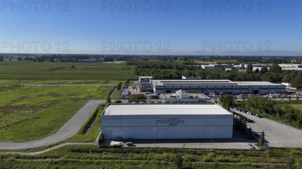 Cremona, Italy - August 22nd 2025 Aerial View of a Modern Data Center Facility with Cooling Towers in a Rural Industrial Landscape Under a Clear Blue Sky in Lombardy Italy