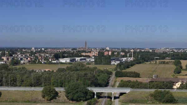 Panoramic view of Cremona skyline and agricultural landscape near a Northern Italian city under a clear blue sky