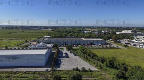 Cremona, Italy - August 22nd 2025 Modern Data Center Facility in Northern Italy Offering Advanced Cloud Storage Solutions Amidst a Rural Industrial Landscape