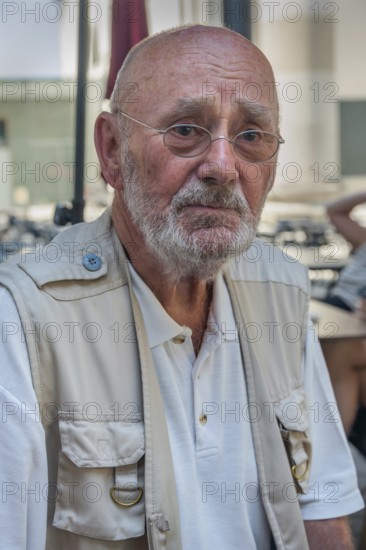 Elderly gentleman with beard, glasses and a somewhat sad look, Dornbirn, Vorarlberg, Austria