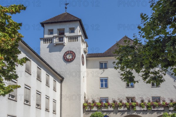 Light grey façade with tower, clock and floral decorations, Dornbirn, Vorarlberg, Austria