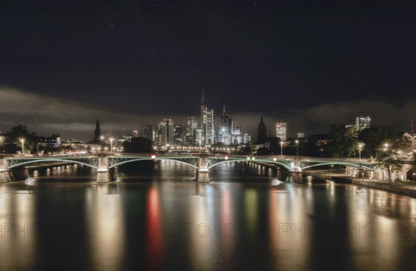 Frankfurt skyline, Main bridge and river at night under the stars, city centre, Frankfurt am Main, Hesse, Germany