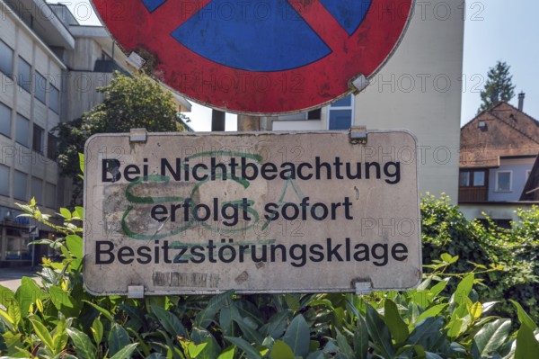 No stopping sign with the notice In the event of non-compliance, immediate action for possession will be taken, Dornbirn, Vorarlberg, Austria