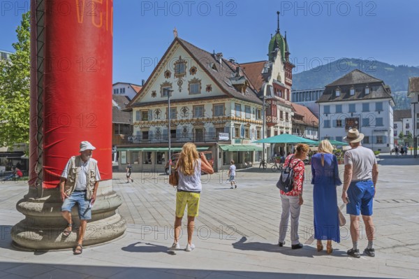The Steinhauser or Johann Luger House and the town museum with tourists on the market square, Dornbirn, Vorarlberg, Austria