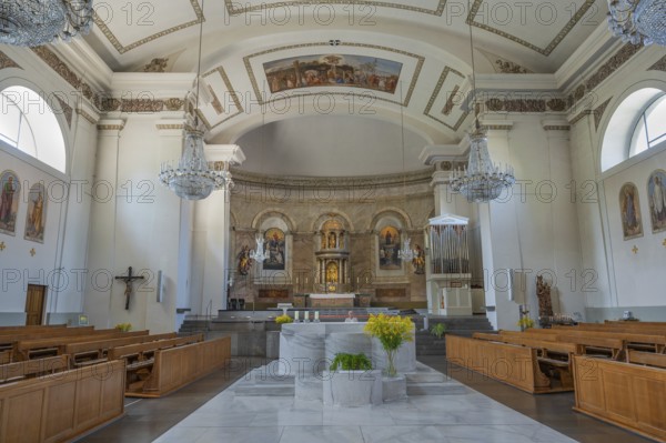 The Roman Catholic parish church of St Martin, altar with floral decorations, interior, Dornbirn, Vorarlberg, Austria