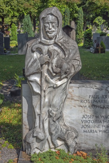 Gravesite with stone figure, the good shepherd with lambs, catholic cemetery, Kempten, Allgäu, Bavaria, Germany