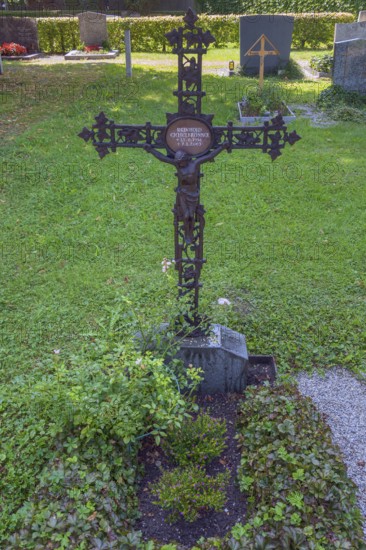 Gravesite with wrought-iron crucifix, Catholic cemetery, Kempten, Allgäu, Bavaria, Germany
