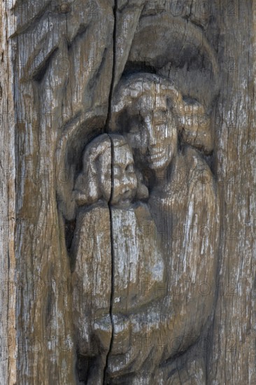 Wooden grave column with carving, mother and child, catholic cemetery, Kempten, Allgäu, Bavaria, Germany